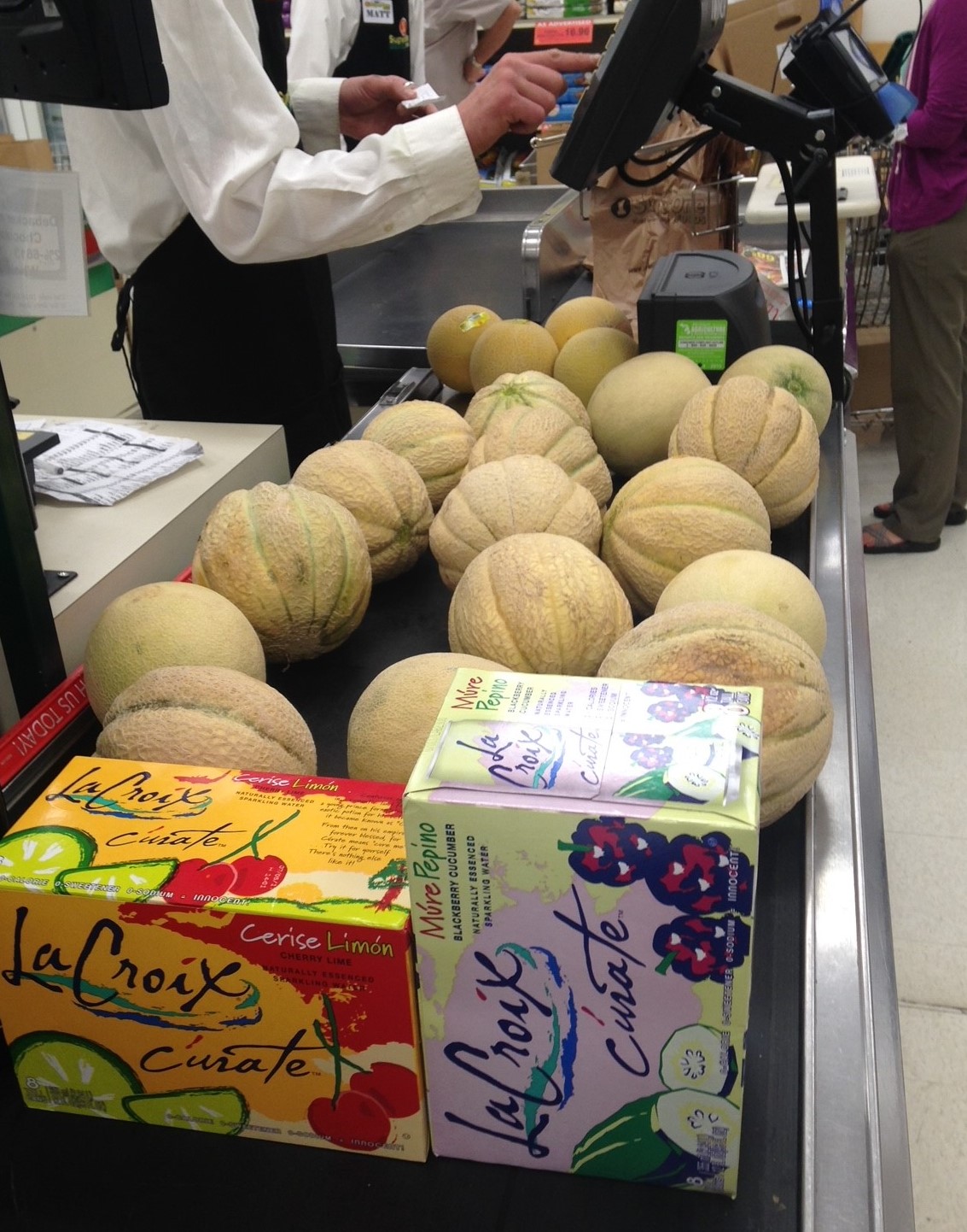 Melons in a checkout line at a grocery store